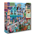 Jigsaw puzzle box with a colorful village scene design on a white background
