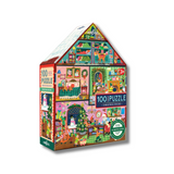 A 100-piece jigsaw puzzle box shaped like a house, featuring a colorful Christmas village scene with Santa, elves, snowman, and holiday decorations. The brand 'eeBoo' is visible on the top and side panels.