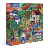 Jigsaw puzzle box with a colorful illustration of people at an apple orchard and market.
