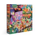 Jigsaw puzzle box with colorful design of a cottage and nature elements on a white background
