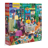 A 1000-piece jigsaw puzzle box by Cellar Puzzles Love, featuring a colorful illustrated scene of women gathering around a table in a cozy tea room with books, plants, and a dog.