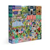 Jigsaw puzzle box with a colorful illustration of a country fair on a white background