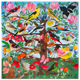 A colorful jigsaw puzzle featuring a whimsical tree of life design with various birds perched on branches, surrounded by pink flowers, green leaves, and small animals on a light blue background. 