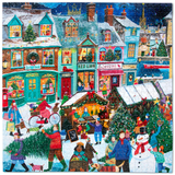 A colorful jigsaw puzzle depicting a busy Christmas village scene with snow-covered buildings, storefronts, market stalls, people, trees, and a snowman, shown against a dark blue background.