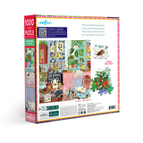 Jigsaw puzzle box with colorful illustrations of a kitchen scene on a white background