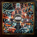 A square Star Wars themed jigsaw puzzle featuring a highly detailed, circular collage of iconic scenes and characters in a dark, dramatic palette with gold decorative borders. The central black circle contains the white 'STAR WARS' logo.