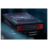 A close-up of a black and red Star Wars themed playing card deck box, featuring the quote 'THE FORCE IS STRONG WITH THIS ONE'.