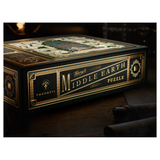 theory 11 Middle Earth Puzzle box, featuring an ornate dark green and gold design with a detailed map on the lid, set on a dark wooden surface.