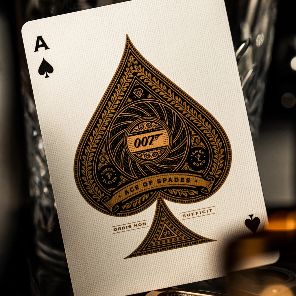 A close-up of an Ace of Spades playing card featuring a James Bond 007 design, resting against a dark, blurred background.