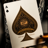 A close-up of an Ace of Spades playing card featuring a James Bond 007 design, resting against a dark, blurred background.